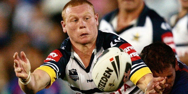 NEWCASTLE, AUSTRALIA - AUGUST 22: Anthony Watts of the Cowboys passes the ball during the round 24 NRL match between the Newcastle Knights and the North Queensland Cowboys at EnergyAustralia Stadium on August 22, 2009 in Newcastle, Australia. (Photo by Corey Davis/Getty Images)