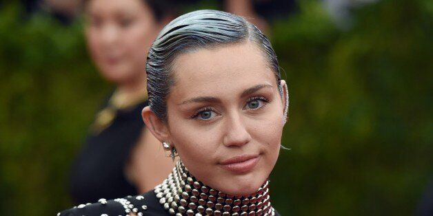 Miley Cyrus arrives at the 2015 Metropolitan Museum of Art's Costume Institute Gala benefit in honor of the museums latest exhibit China: Through the Looking Glass May 4, 2015 in New York. AFP PHOTO / TIMOTHY A. CLARY (Photo credit should read TIMOTHY A. CLARY/AFP/Getty Images)