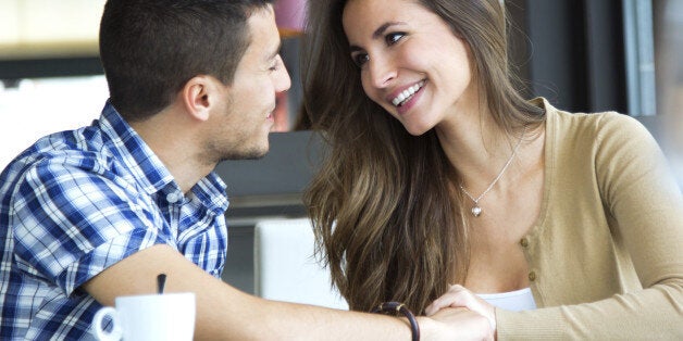 Portrait of young couple in love at a coffee shop