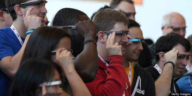 SAN FRANCISCO, CA - MAY 17: Attendees wear Google Glass while posing for a group photo during the Google I/O developer conference on May 17, 2013 in San Francisco, California. Eight members of the Congressional Bi-Partisan Privacy Caucus sent a letter to Google co-founder and CEO Larry Page seeking answers to privacy questions and concerns surrounding Google's photo and video-equipped glasses called 'Google Glass'. The panel wants to know if the high tech eyeware could infringe on the privacy of Americans. Google has been asked to respond to a series of questions by June 14. (Photo by Justin Sullivan/Getty Images)