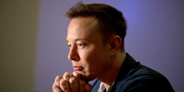 Elon Musk, co-founder and chief executive officer of Tesla Motors Inc., pauses during an interview at the company's assembly