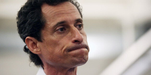 NEW YORK, NY - JULY 23: Anthony Weiner, a leading candidate for New York City mayor, stands with his wife Huma Abedin during a press conference on July 23, 2013 in New York City. Weiner addressed news of new allegations that he engaged in lewd online conversations with a woman after he resigned from Congress for similar previous incidents. (Photo by John Moore/Getty Images)