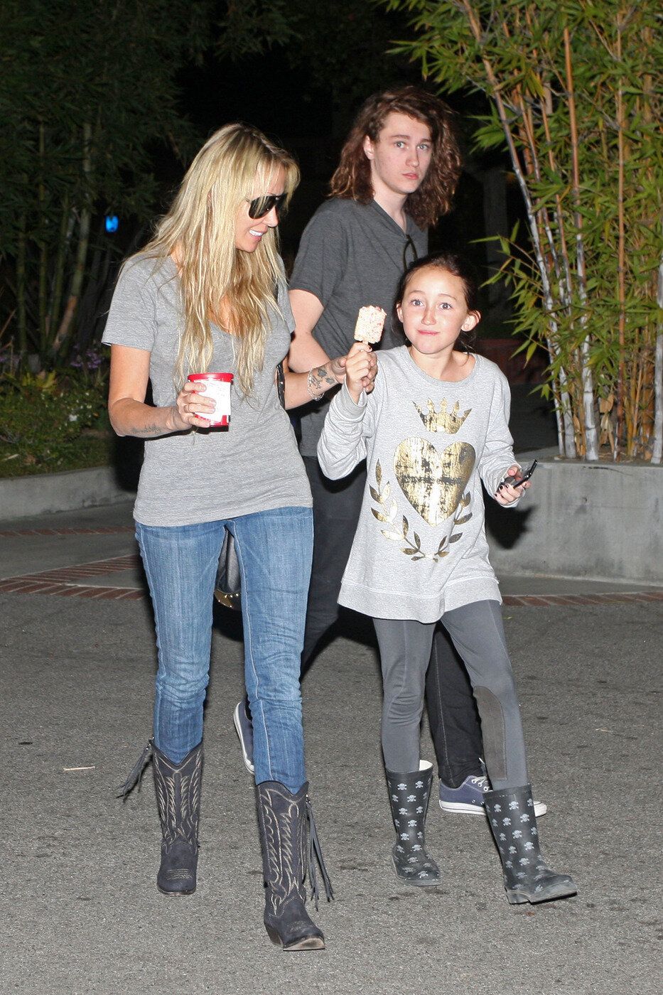 With his mom, Leticia Cyrus, and younger sister Noah in October 2010