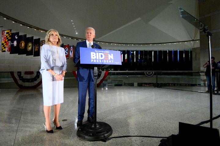 Former Vice President Joe Biden, flanked by his wife, Dr. Jill Biden, delivers remarks in Philadelphia on March 10. It was another good primary day for Biden, but coronavirus concerns kept the celebration muted.