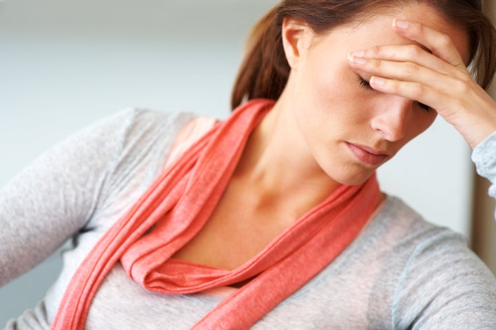 Closeup portrait of a young woman looking depressed