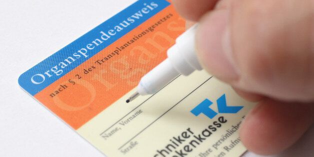 BERLIN, GERMANY - NOVEMBER 13: In this photo illustration a real organ donor's card (Organspendeausweis) from public health insurer Techniker Krankenkasse is seen on November 13, 2012 in Berlin, Germany. German health insurance companies are sending out the cards to their policy holders in an effort to get more people registered for organ donation. Demand for organs in Germany is high and waiting lists are long. (Photo by Sean Gallup/Getty Images)