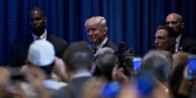 Donald Trump, 2016 Republican presidential nominee, center, arrives to deliver an address on Obamacare in King of Prussia, Pe