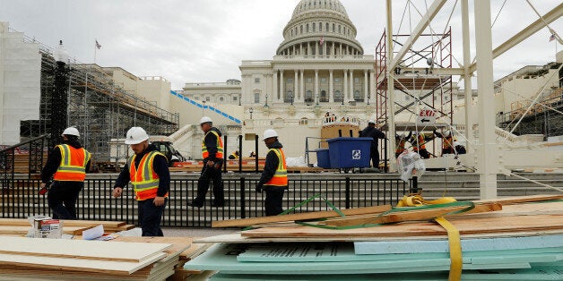 Workers construct the viewing stands ahead of U.S. President-elect Donald Trump's January inauguration at the U.S. Capitol in