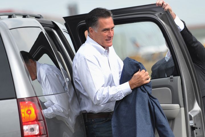 Republican presidential candidate Mitt Romney steps out of a SUV as he arrives September 24, 2012 at Denver International Airport. Romney is heading to Pueblo, Colorado for a campaign rally and then to New York City. AFP PHOTO/Mandel NGAN (Photo credit should read MANDEL NGAN/AFP/GettyImages)
