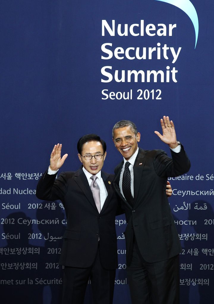 U.S. President Barack Obama, right, and Lee Myung Bak, South Korea's president, wave during a photo session before the working dinner at the 2012 Seoul Nuclear Security Summit in Seoul, South Korea, on Monday, March 26, 2012. World leaders may pledge tighter controls over nuclear materials to keep them out of the hands of terrorists, according to a draft communique to be released at the end of their two-day meeting in Seoul. Photographer: SeongJoon Cho/Bloomberg via Getty Images 