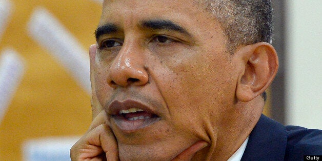 US President Barack Obama listens to students as he tours Mooresville Middle School in Mooresville, North Carolina, on June 6, 2013. Obama arrived in North Carolina as part of his Middle Class Jobs & Opportunity Tour. AFP PHOTO/Jewel Samad (Photo credit should read JEWEL SAMAD/AFP/Getty Images)