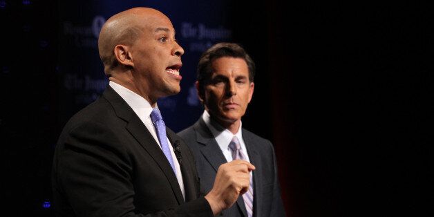 GLASSBORO, NJ - OCTOBER 9: U.S. Senate candidate Cory Booker (L) speaks during his second televised debate with Steve Lonegan (not pictured) at Pfleeger Concert Hall, Wilson Hall, Rowan University, on October 9, 2013 in Glassboro, New Jersey. Voters go to the polls November 5. (Photo by Michael Bryant-Pool/Getty Images)