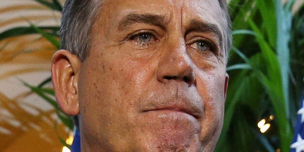 WASHINGTON, DC - OCTOBER 15: House Speaker John Boehner (R-OH) (C) speaks to the media following a House Republican caucus meeting at the U.S. Capitol, October 15, 2013 in Washington, DC. With the government shutdown going into the fifttenth day and the deadline for raising the debt ceiling fast approaching, Democrats and Republicans may come to an agreement soon on passing a budget. (Photo by Mark Wilson/Getty Images)