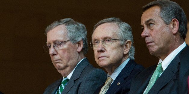 WASHINGTON, DC - JUNE 19: (L-R) Senate Minority Leader Mitch McConnell (R-KY), Senate Majority Leader Harry Reid (D-NV), and Speaker of the House John Boehner (R-OH) are seen during a dedication ceremony for the new Frederick Douglass Statue in Emancipation Hall in the Capitol Visitor Center, at the U.S. Capitol, on June 19, 2013 in Washington, DC. The 7 foot bronze statue of Douglass joins fellow black Americans Rosa Parks, Martin Luther King Jr. and Sojourner Truth on permanent display in the Capitol's Emancipation Hall. (Photo by Drew Angerer/Getty Images)