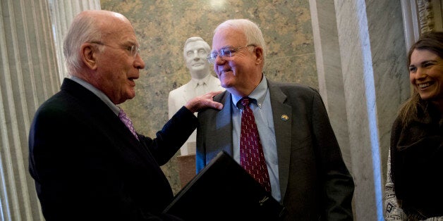 UNITED STATES - JANUARY 22: Sen. Pat Leahy, D-Vt., left, talks with Rep. Jim Sensenbrenner, R-Wisc., before the senate luncheons in the Capitol. Sensenbrenner was giving a tour on the senate side. (Photo By Tom Williams/CQ Roll Call)