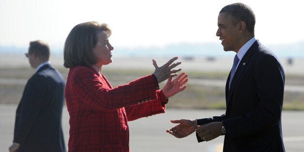 US President Barack Obama is greeted by Senator Diane Feinstein(D-CA) upon arriving at San Francisco International Airport in San Francisco, California, on November 25, 2013. Obama arrived in San Francisco to speak on immigration reform. AFP Photo/Jewel Samad (Photo credit should read JEWEL SAMAD/AFP/Getty Images)