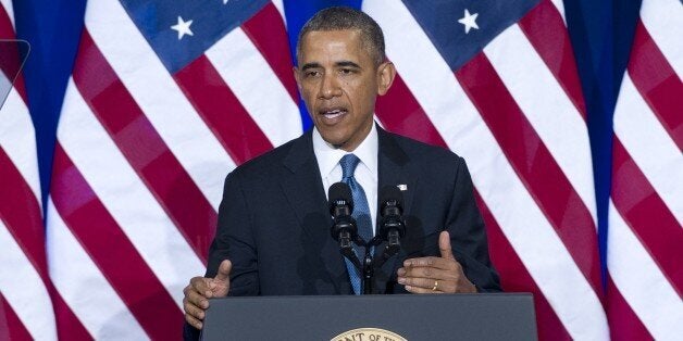 US President Barack Obama speaks about the National Security Agency (NSA) and intelligence agencies surveillance techniques at the US Department of Justice in Washington, DC, January 17, 2014. AFP PHOTO / Saul LOEB (Photo credit should read SAUL LOEB/AFP/Getty Images)