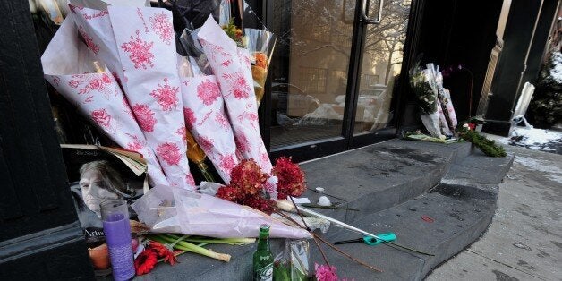A makeshift memorial for actor Philip Seymour Hoffman at the entrance to the apartment building where he died February 4, 201