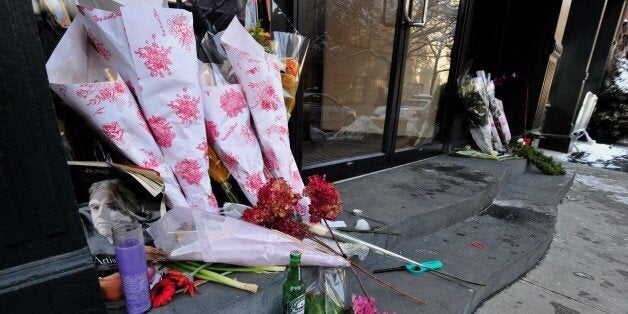 A makeshift memorial for actor Philip Seymour Hoffman at the entrance to the apartment building where he died February 4, 2014 in the Greenwich Village area of New York. AFP PHOTO/Stan HONDA (Photo credit should read STAN HONDA/AFP/Getty Images)