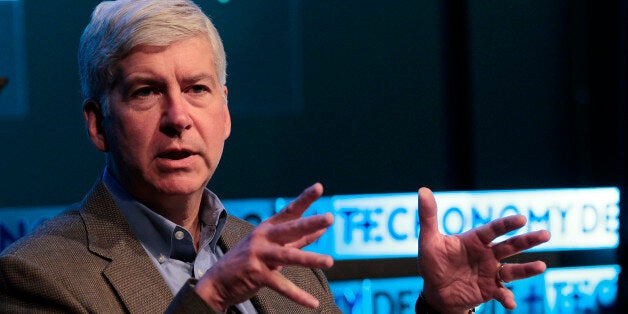 Rick Snyder, governor of Michigan, speaks to reporters at the Techonomy conference at Wayne State University in Detroit, Michigan, U.S., on Tuesday, Sept. 17, 2013. Synder, a Republican, spoke about efforts to boost technology jobs in Detroit and the city's bankruptcy. Photographer: Jeff Kowalsky/Bloomberg via Getty Images
