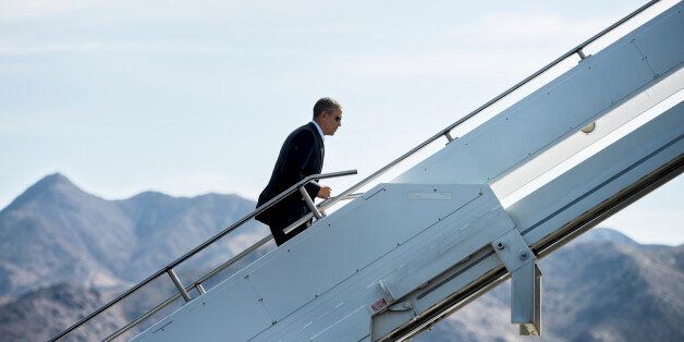 US President Barack Obama boards Air Force One at Palm Springs International Airport February 17, 2014 in Palm Springs, California. President Obama is returning to Washington,DC after spending the holiday weekend golfing in California. AFP PHOTO/Brendan SMIALOWSKI (Photo credit should read BRENDAN SMIALOWSKI/AFP/Getty Images)