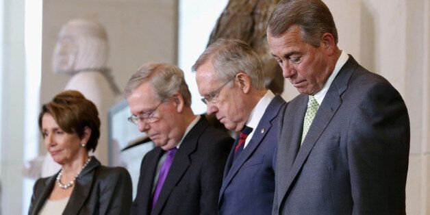 WASHINGTON, DC - NOVEMBER 20: (L-R) House Minority Leader Nancy Pelosi (D-CA), Senate Minority Leader Mitch McConnell (R-KY), Senate Majority Leader Harry Reid (D-NV) and Speaker of the House John Boehner (R-OH) bow their heads in prayer during the Congressional Gold Medal ceremony for the 33 Native American tribes whose members served as military code talkers during World War I and World War II in Emancipation Hall at the U.S. Capitol Visitors Center November 20, 2013 in Washington, DC. Hundreds of Native Americans served in the world wars as code talkers, soldiers who developed codes built upon their native languages to transmit secret tactical messages over military telephone or radio communications, improvind speed and encryption at both ends in front line operations during World War II. (Photo by Chip Somodevilla/Getty Images)