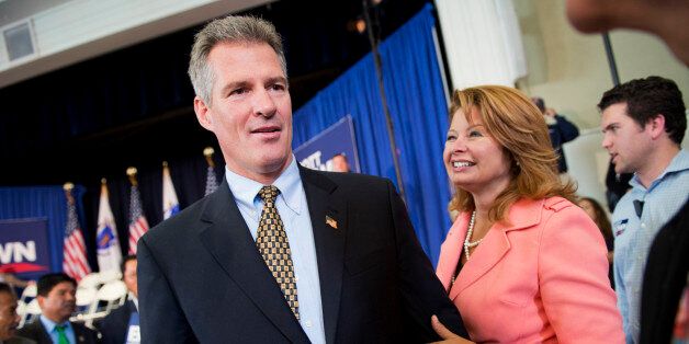 UNITED STATES - OCTOBER 21: Sen. Scott Brown, R-Mass., and his wife Gail Huff, attend at rally in Cumnock Hall at the University of Massachusetts Lowell campus in Lowell, Mass. Brown is being challenged for his seat by democrat Elizabeth Warren. (Photo By Tom Williams/CQ Roll Call)