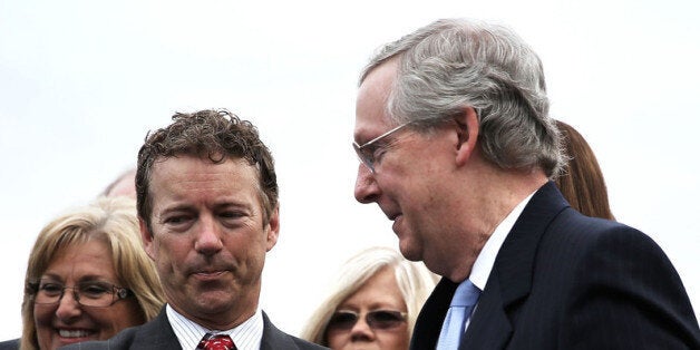 WASHINGTON, DC - MAY 16: U.S. Senate Minority Leader Sen Mitch McConnell (R-KY) (R) shakes hands with Sen. Rand Paul (R-KY) (L) during a news conference May 16, 2013 on Capitol Hill in Washington, DC. Rep. Michele Bachmann (R-MN) held a news conference with Tea Party leaders and congressional members to discuss the IRS scandal of targeting the Tea Party. (Photo by Alex Wong/Getty Images)