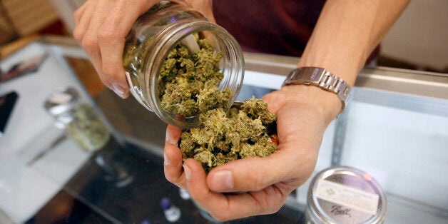 LOS ANGELES, CA - JULY 25: A budtender pours marijuana from a jar at Perennial Holistic Wellness Center medical marijuana dispensary, which opened in 2006, on July 25, 2012 in Los Angeles, California. The Los Angeles City Council has unanimously voted to ban storefront medical marijuana dispensaries and to order them to close or face legal action. The council also voted to instruct staff to draw up a separate ordinance for consideration in about three months that might allow dispensaries that existed before a 2007 moratorium on new dispensaries to continue to operate. It is estimated that Los Angeles has about one thousand such facilities. The ban does not prevent patients or cooperatives of two or three people to grow their own in small amounts. Californians voted to legalize medical cannabis use in 1996, clashing with federal drug laws. The state Supreme Court is expected to consider ruling on whether cities can regulate and ban dispensaries. (Photo by David McNew/Getty Images)