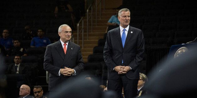 NEW YORK, NY - JUNE 30: New York City Mayor Bill De Blasio (R) and Police Commissioner Bill Bratton attend the 2014 New York Police Department (NYPD) graduation ceremony on June 30, 2014 at Madison Square Garden in New York City. The NYPD, which has over 35,000 officers, graduated 604 new officers today. (Photo by Andrew Burton/Getty Images)