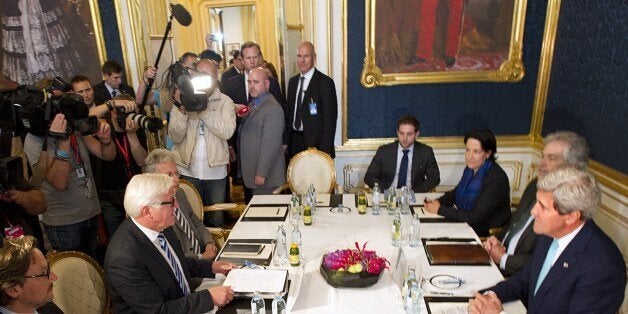 US Secretary of State John Kerry (R) sits in front of German Foreign minister Frank-Walter Steinmeier (2dL) as they meet at the Coburg Palais in Vienna, on July 13, 2014, during talks of foreign ministers from the six powers negotiating with Tehran on its nuclear programWestern foreign ministers from the P5+1 group of nations are expected in Austria to try and resolve differences with Iran over its nuclear program, a week before the deadline to strike a deal. AFP PHOTO /JOE KLAMAR (Photo credit should read JOE KLAMAR/AFP/Getty Images)