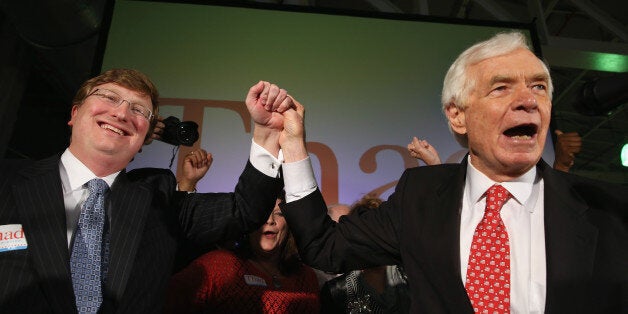 JACKSON, MS - JUNE 24: U.S. Sen. Thad Cochran (R) (R-MS) and Mississippi Lieutenant Governor Tate Reeves (L) celebrate durin