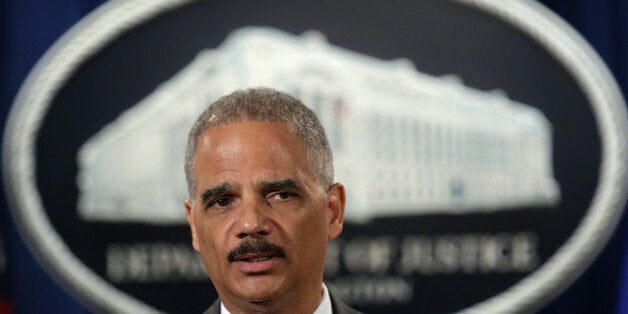 WASHINGTON, DC - JULY 14: U.S. Attorney General Eric Holder speaks during a news conference for a major financial fraud announcement at the Justice Department July 14, 2014 in Washington, DC. Citigroup has agreed to pay the government $7 billion in fines for its misleading investors about some of the mortgage-backed securities sold prior to January 1, 2009. (Photo by Alex Wong/Getty Images)