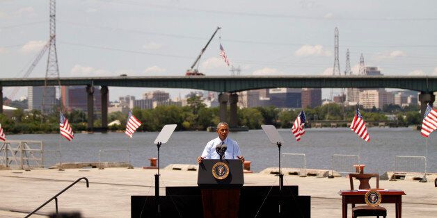 WILMINGTON, DE - JULY 17: U.S. President Barack Obama announces new national infrastructure initiative at the Port of Wilmington, Delaware, in front of the I-495 Bridge, which is undergoing substantial structural repairs on July 17, 2014. The new initiative at the U.S. Department of Transportation will seek to encourage private investment in infrastructure projects such as repairing roads and bridges. (Photo by Jessica Kourkounis/Getty Images)