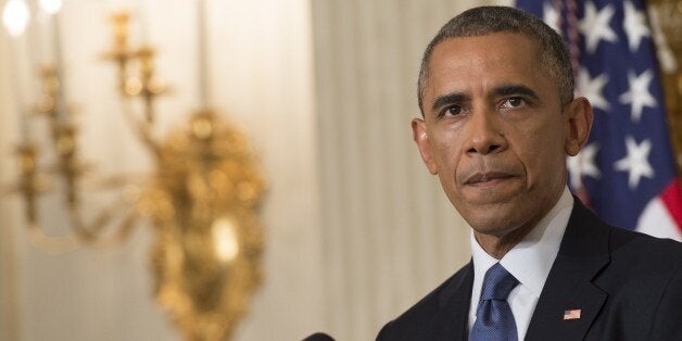 US President Barack Obama speaks about the situation in Iraq in the State Dining Room at the White House in Washington, DC, August 7, 2014. Obama said he authorized air strikes and relief supply drops in Iraq to prevent 'genocide' by Islamist extremists against minorities. 'We can act, carefully and responsibly, to prevent a potential act of genocide,' Obama said, in an address as he announced military action. AFP PHOTO / Saul LOEB (Photo credit should read SAUL LOEB/AFP/Getty Images)