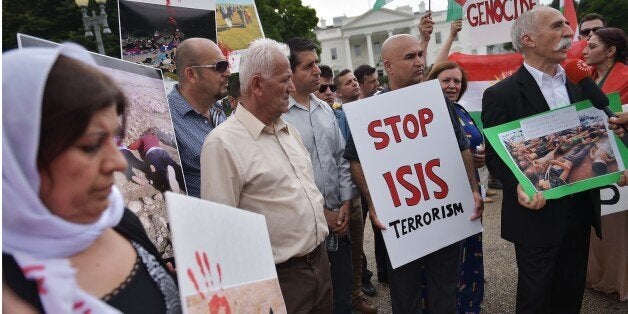 Demonstrators call for the end to Islamic State of Iraq and Syria (ISIS) terrorism during a Kurdish demonstration in front of the White House on August 9, 2014 in Washington, DC. US President Barack Obama warned Saturday that the US offensive in Iraq was a 'long-term project' to rout out militants and deliver aid to beleaguered civilians. AFP PHOTO/Mandel NGAN (Photo credit should read MANDEL NGAN/AFP/Getty Images)