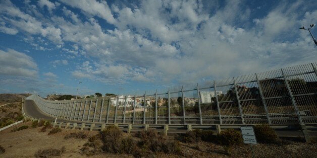 View of the Mexican town of Tijuana from the US side of the border and showing the fence that divides the two countries in San Diego on August 20, 2014. At least 57,000 unaccompanied children, most from Honduras, Guatemala and El Salvador, have crossed the border into the United States illegally since October, triggering a migration crisis that has sent US border and immigration authorities into a frenzy. AFP PHOTO/Mark RALSTON (Photo credit should read MARK RALSTON/AFP/Getty Images)