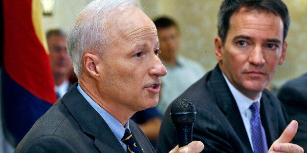 U.S. Rep. Mike Coffman, R-Colo., left, and Democratic challenger Andrew Romanoff face off in their first debate in Highlands Ranch, Colo., Thursday Aug. 14, 2014. The race is expected to be one of the closest in the country. (AP Photo/Brennan Linsley)