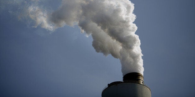 Emissions rise from the American Electric Power Co. Inc. coal-fired John E. Amos Power Plant in Winfield, West Virginia, U.S., on Thursday, July 31, 2014. Power plant coal burning by 2020 must decline by 204 million tons, or 24 percent, to meet U.S. Environmental Protection Agency (EPA) greenhouse gas targets announced June 2, Sanford C. Bernstein & Co. analysts led by Hugh Wynne estimated in a July 23 note to clients. Photographer: Luke Sharrett/Bloomberg via Getty Images