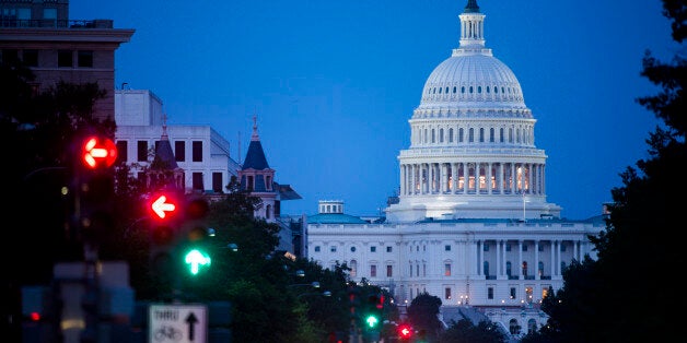 UNITED STATES - JULY 12: The U.S. Capitol as seen from Freedom Plaza on Pennsylvania Avenue on Saturday night, July 12, 2014. (Photo By Bill Clark/CQ Roll Call)