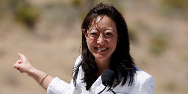 Assistant Secretary of the Interior, Rhea Suh, helps Michelle Obama promote the "Let's Move Outside" program at Red Rock Canyon National Conservation Area outside Las Vegas Tuesday, June 1, 2010 in Red Rock Canyon. (AP Photo/Isaac Brekken)