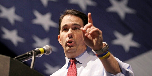 FILE - In this May 3, 2014 file photo, Wisconsin Gov. Scott Walker speaks at the Republican party of Wisconsin State Convention in Milwaukee. Gov. Walker emerged with a major victory this week when a federal court halted a secret investigation into his 2012 recall campaign and conservative groups that supported him, ruling the probe was a breach of free-speech rights. The decision could boost his re-election campaign and better his prospects for a possible 2016 presidential run. (AP Photo/Jeffrey Phelps)