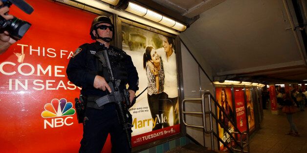 NEW YORK, UNITED STATES - SEPTEMBER 17: New York City Police officer stands guard in metro station in New York, United States on 17 September, 2014. Security measures tightened on critical points of New York after Islamic State of Iraq and the Levant call for terrorist attack against New York on the social media. (Photo by Bilgin Sasmaz/Anadolu Agency/Getty Images)
