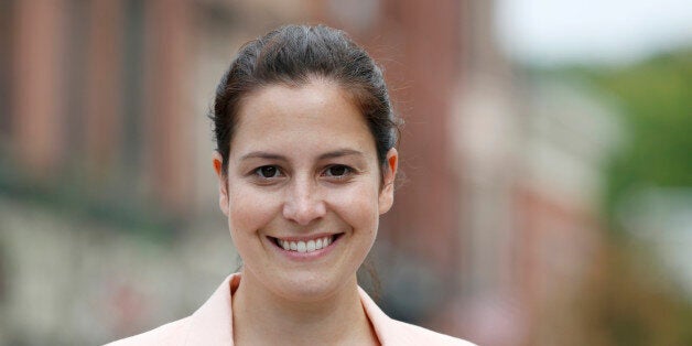 Republican Congressional candidate Elise Stefanik poses on Wednesday, Aug. 27, 2014, in Ballston Spa, N.Y. Stefanik is running for a House seat in northern New York. (AP Photo/Mike Groll)