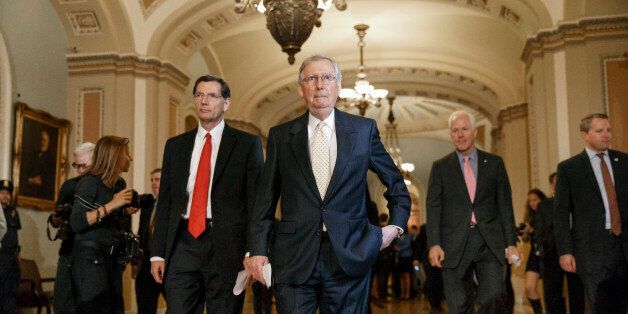 Senate Minority Leader Mitch McConnell, R-Ky., center, flanked by Sen. John Barrasso, R-Wyo., Republican Policy Committee chairman, left, and Senate Minority Whip John Cornyn, R-Texas, right, arrives to speak with reporters following a GOP policy lunch at the Capitol in Washington, Tuesday, Sept. 16, 2014. Republicans are increasingly optimistic that they can tilt enough seats to capture the Senate majority for the first time since the 2006 elections. (AP Photo/J. Scott Applewhite)