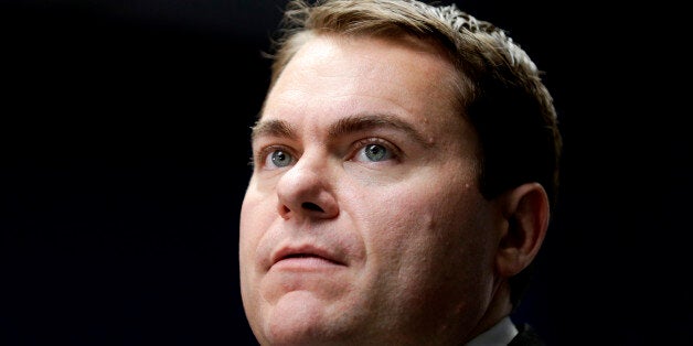 California Republican Congressional candidate Carl DeMaio pauses while speaking at his campaign headquarters, Tuesday, Oct. 21, 2014, in San Diego. The race for a San Diego congressional seat already was one of the closest and most expensive in the country. In recent weeks, it also has taken a number bizarre twists that have nothing to do with disagreements about health care reform or federal spending. The Republican challenger, former city councilman Carl DeMaio, has been at the center of multiheaded controversy about his campaign. It includes a late-night break-in at his headquarters, a stolen campaign playbook that ended up in the hands of his opponent and sexual harassment accusations made against the candidate by a fired staffer who, like DeMaio, is gay. (AP Photo/Gregory Bull)