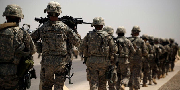 In this Tuesday, Aug. 2, 2011 photo, U.S. Army soldiers make their way to a C-130 aircraft at Sather Air Base in Baghdad, Iraq to begin their journey home to the United States. The U.S. has promised to withdraw from Iraq by the end of the year as required by a 2008 security agreement between Washington and Baghdad. Some 44,000 U.S. troops and an estimated 58,000 American contractors are scheduled to clear out _ along with their equipment. It's still unclear if the U.S. military will keep several thousand troops in Iraq as leaders weigh whether staunch political opposition in both nations is worth the risk. The uncertainty has been a logistical nightmare for American commanders, who could be asked at the last minute to keep some equipment and manpower back _ but for now must push ahead in case the withdrawal plan stands. (AP Photo/Maya Alleruzzo)