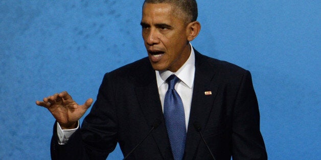 US President Barack Obama speaks at the APEC CEO Summit at the China National Convention Center (CNCC) in Beijing, Monday, Nov. 10, 2014, as part of the Asia-Pacific Economic Cooperation (APEC) Summit. (AP Photo/Wang Zhao, Pool)