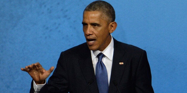 US President Barack Obama speaks at the APEC CEO Summit at the China National Convention Center (CNCC) in Beijing, Monday, Nov. 10, 2014, as part of the Asia-Pacific Economic Cooperation (APEC) Summit. (AP Photo/Wang Zhao, Pool)