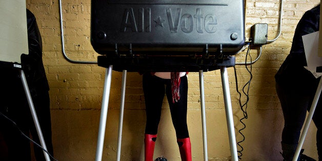 FILE PHOTO: 'BEST PHOTOS OF 2012' (***BESTOF2012***): Voters cast their ballots at a polling location in Chicago, Illinois, U.S., on Tuesday, Nov. 6, 2012. U.S. President Obama is seeking to overcome the drag of high unemployment and economic weakness that has frustrated predecessors' re-election bids, while his Republican rival Mitt Romney reaches for an upset to propel him beyond his party's standing and swamp an electoral map stacked against him on the final day of the presidential race. Photographer: Daniel Acker/Bloomberg via Getty Images